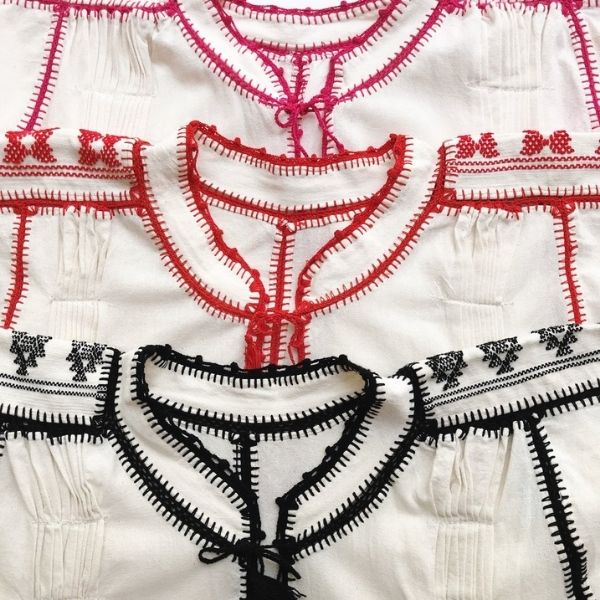 Embroidery detail on the neck and sleeves of this blouse are handcrafted by artisans in Mexico-cream top with contrasting color stitching-Nifty